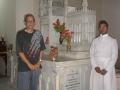 The famous altar at the Church dedicated to Mary Rebecca Weston now fully repaired. Anand Sethi and father Titus beside it.